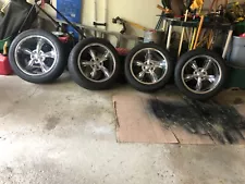 Chrome rims and tires for a Chrysler. 4 tires size 18