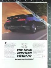 1985 AD, Pontiac Fiero GT. Spoiler, taillight, right 1/4 panel, door, decal view