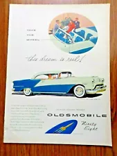 1954 Oldsmobile 98 Ninety Eight Deluxe Holiday Coupe & Convertible Ad