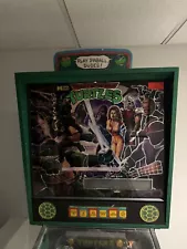 Teenage Mutant Ninja Turtles Pinball Machine by Data East. Needs repair.