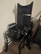 Dalton wheelchair for sale. Includes headrest, seatbelts, and footrests.