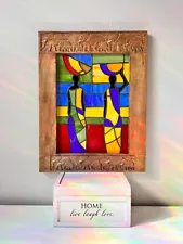 ART. Stained glass window in a wooden frame. Tiffany technique. Africa. People.