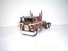 DCP FIRST GEAR 1/64 BROWN WITH STRIPE PETERBILT 352 WITH 110" SLEEPER CAB