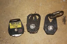 3 very strong steel pulleys 2 types for rope or cable 1 says 3000 lbs