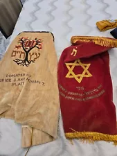 A GROUP OF TWOVELVET TORAH COVERS MANTELS, 6 GARTELS AND A TALLIS BAG