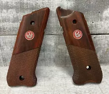 Factory Ruger Mark IV Wood Grips With Red Medallions.