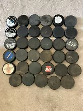 35 Used Ice Hockey Pucks, good for practice and warmups