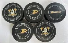 Lot of 5 Anaheim Ducks NHL Official Game Pucks