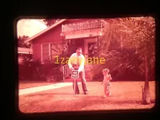 3V02 VINTAGE Photo 35mm Slide MAN PUTTING FOR SALE SIGN IN YARD