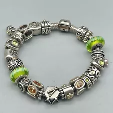 Pandora charm bracelet with 23 pieces. 7 1/4" long.