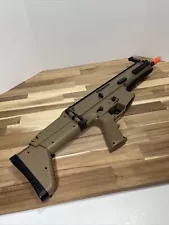 Spring loaded airsoft gun tan scar L 6mm plastic bb with a collapsing stock