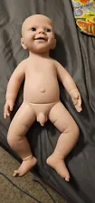 full body silicone baby boy used has some rips.