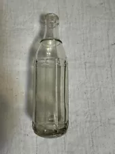 Straight-sided clear soda bottle