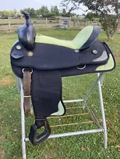 Used 14" black synthetic Western saddle w/lime green seat & accents