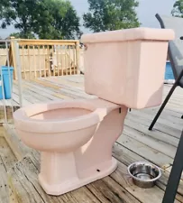 Vintage pink 1963 bathroom toilet