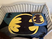 Gray toddler bed with Batman bedding