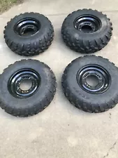 Set of (4) Carlisle ATV tires mounted on rims 25X8X12 and 25X10X12 (For: Polaris 6x6)