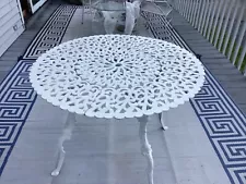 White Wrought Iron Table with Matching Chairs.