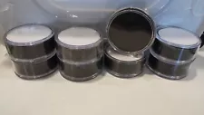 8 hockey pucks with each individual puck tube