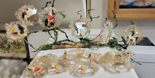 Fifteen silver Tinsel Wreaths, with Paper Santa, Snowman. in Middle. W. Germany