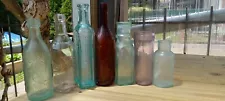 Lot of 7 Antique Embossed / Unembossed Bottles