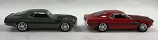 Two 1:64 CHIP FOOSE 65 MUSTANGS. DISPLAY USED ONLY in MINT CONDITION!