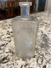 Old glass bottle. Chipped on top.