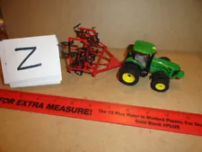 1/64 John Deere 8320R Tractor with a International field cultivator