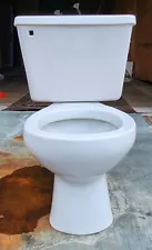 Light gray toilet made by Briggs vintage bathroom