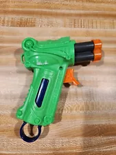 Small Green Toy Dart Gun Powered by pt-oz