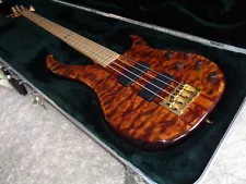 2005 Peavey USA Cirrus Custom Shop IV Bass Guitar Tiger Eye Quilted Maple Top.