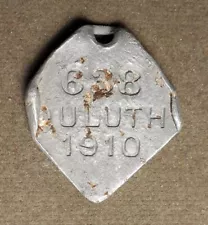 Dog License Tax Tag: Duluth (MN), 1910, #688. Aluminum, diamond shape, corners t