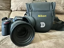 Nikon D5100 DSLR with 18-200 Lens