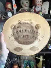 Ouija spirit board for cheese and wine