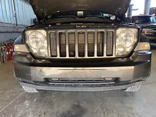 Used Front Bumper Assembly fits: 2011 Jeep Liberty painted lower center bar Fron