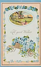 Greetings embossed postcard/tiny blue flowers/gold wheelbarrow/country/home/