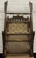 Antique ornate wooden folding rocking chair with needlepoint /nailhead trim