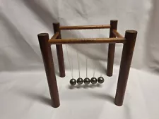 Vintage Swinging Wonder Newton Cradle Newtonian Demonstrator Wood Base V.G. Cond