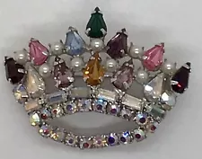 Up for sale is a vintage Unsigned AB rhinestone Crown brooch. In Mint condition.