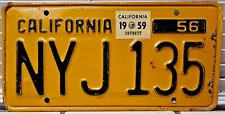 1956 California single black on yellow license plate with a 1959 sticker NYJ135