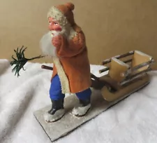 German Santa Claus Pulling Wooden Sleigh Figurine Blue Pants 1930s Christmas