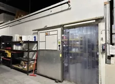 Used commercial walk in cooler, 16' x . Sliding door for pallets. Rooftop unit.