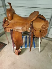 used 17" Chris Cox ranch cutter brown color saddle with oak leaf tooling