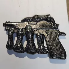 Skeleton Hand Holding Gun Belt Buckle