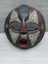 Large Ghana African Tribal Mask Hand carved Wood With Metal On It.