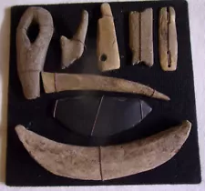 Collection of framed inuit artifacts, From the west coast of Alaska