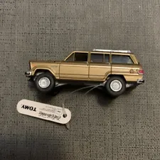 ERTL Collectibles TOMY Gold Jeep Wagoneer Metal, Rubber Tires W/Tag