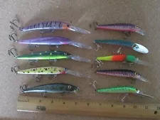 Lot 48 - 10 fishing lure lures out of old tackle box