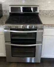 6.0 cu. ft. Double Oven Gas Range with Center Oval Burner in Stainless Steel