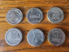 6 Las Vegas $1 slot coins from Aladdin (2), Sams Town, Holliday, Nob Hill & MGM